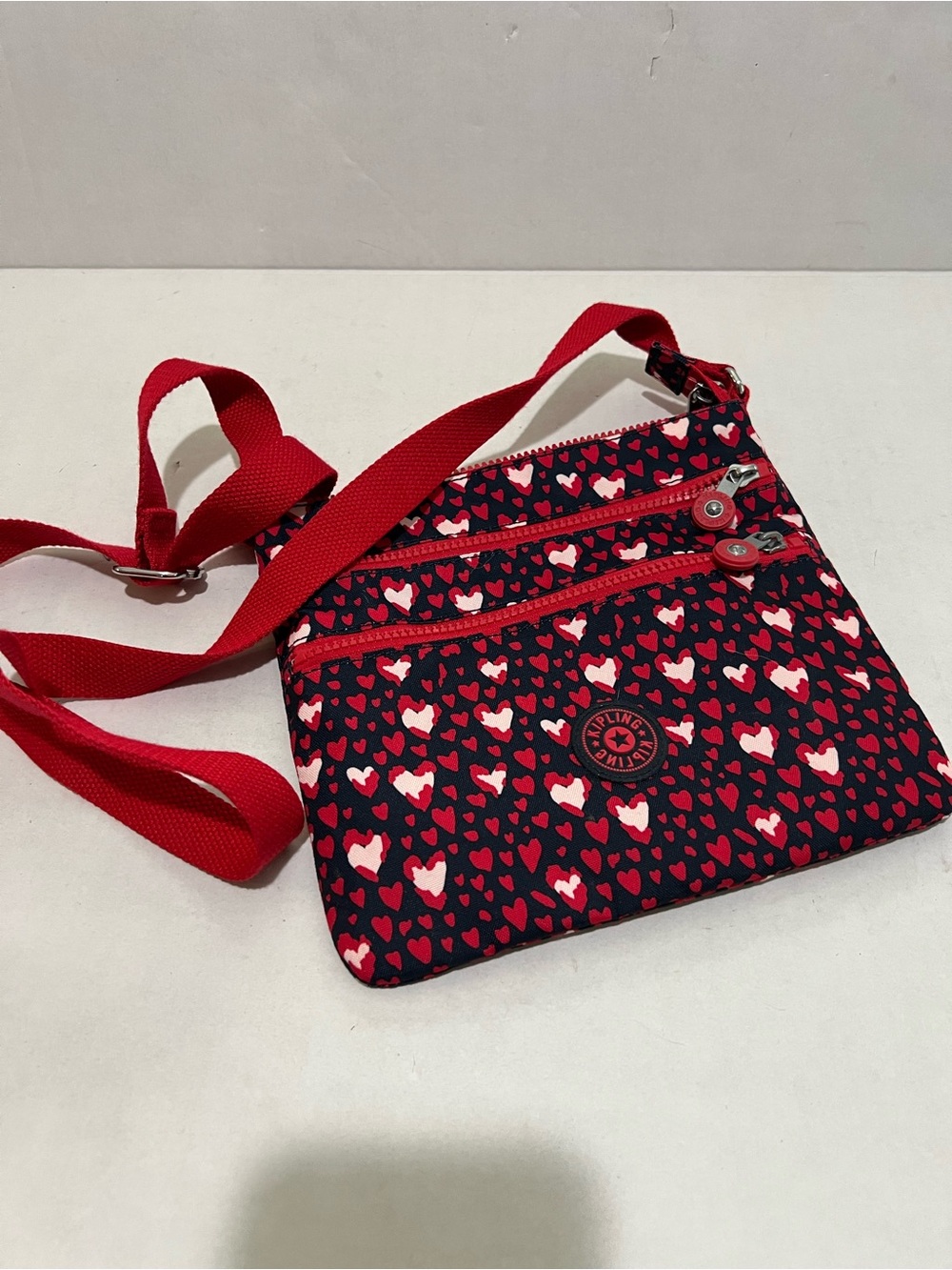 Kipling Abner Crossbody Bag in the Red Hearts Festival print